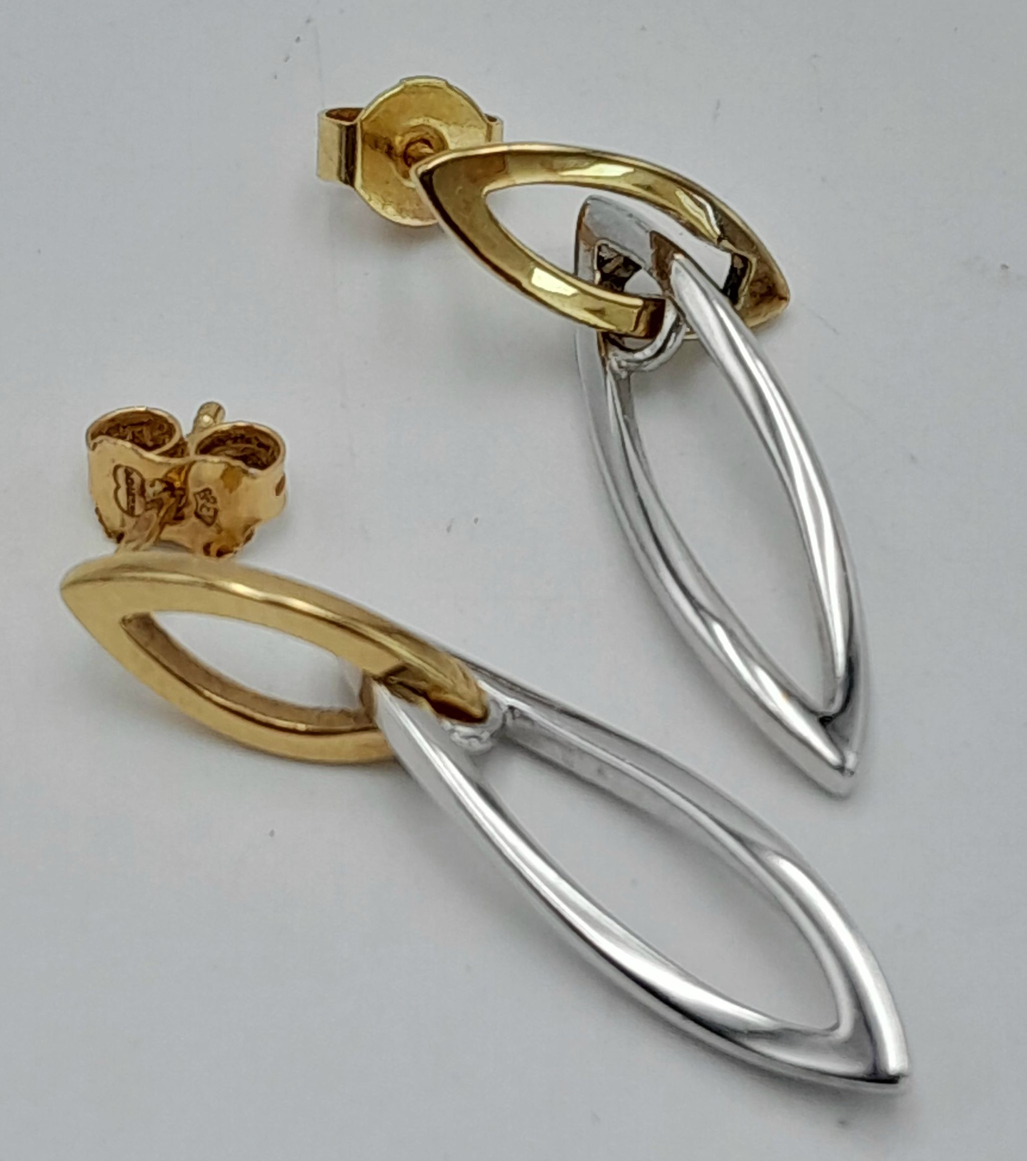 A Pair of 9K Yellow and White Gold Drop Earrings in Twisted Leaf Form