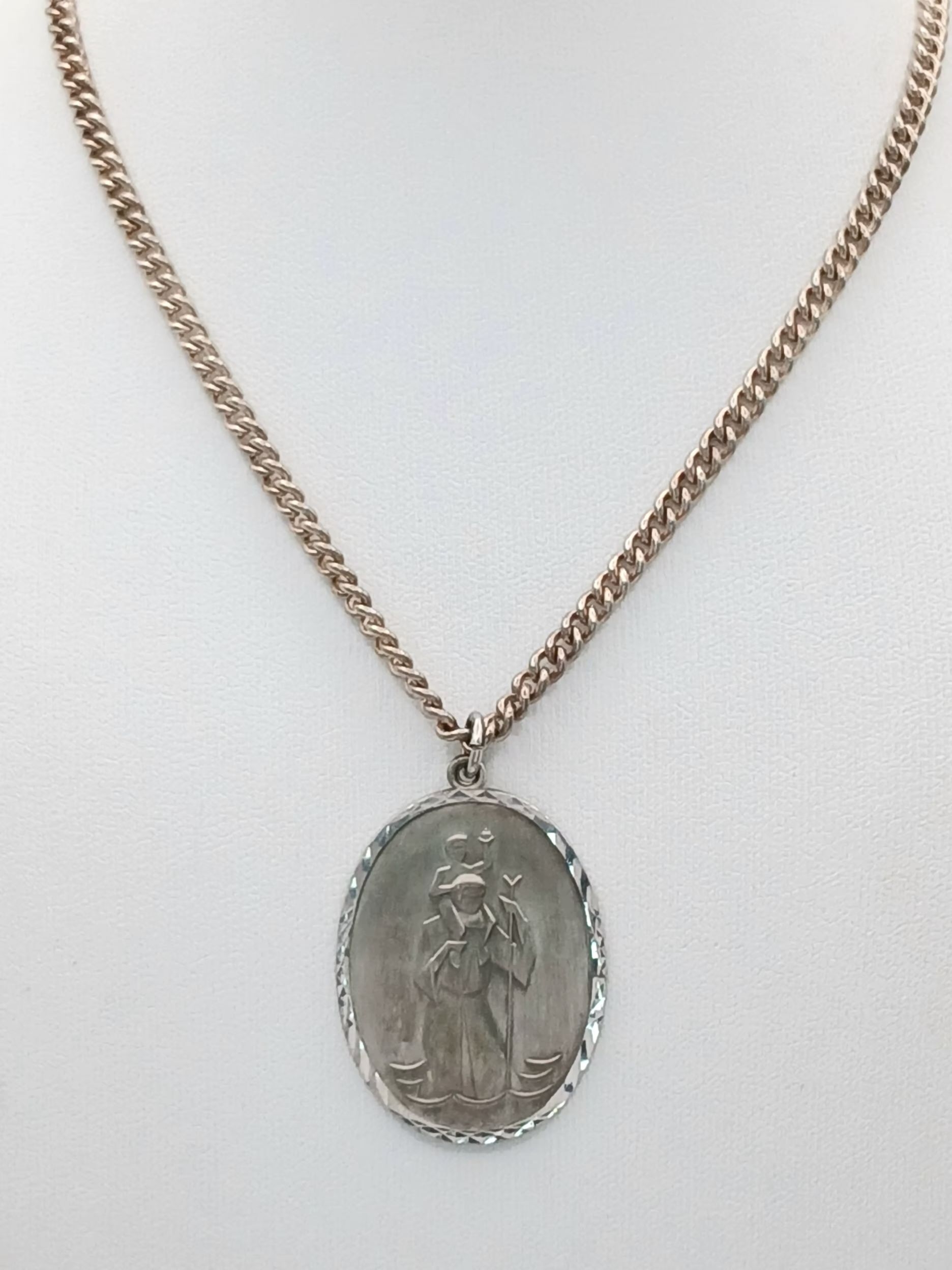 A vintage sterling silver St.Christopher pendant on silver necklace