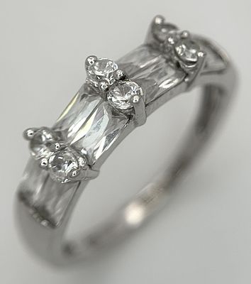 A 9K Yellow Gold Fancy CZ Band Ring. Size K 1/2. 2.45g total weight.