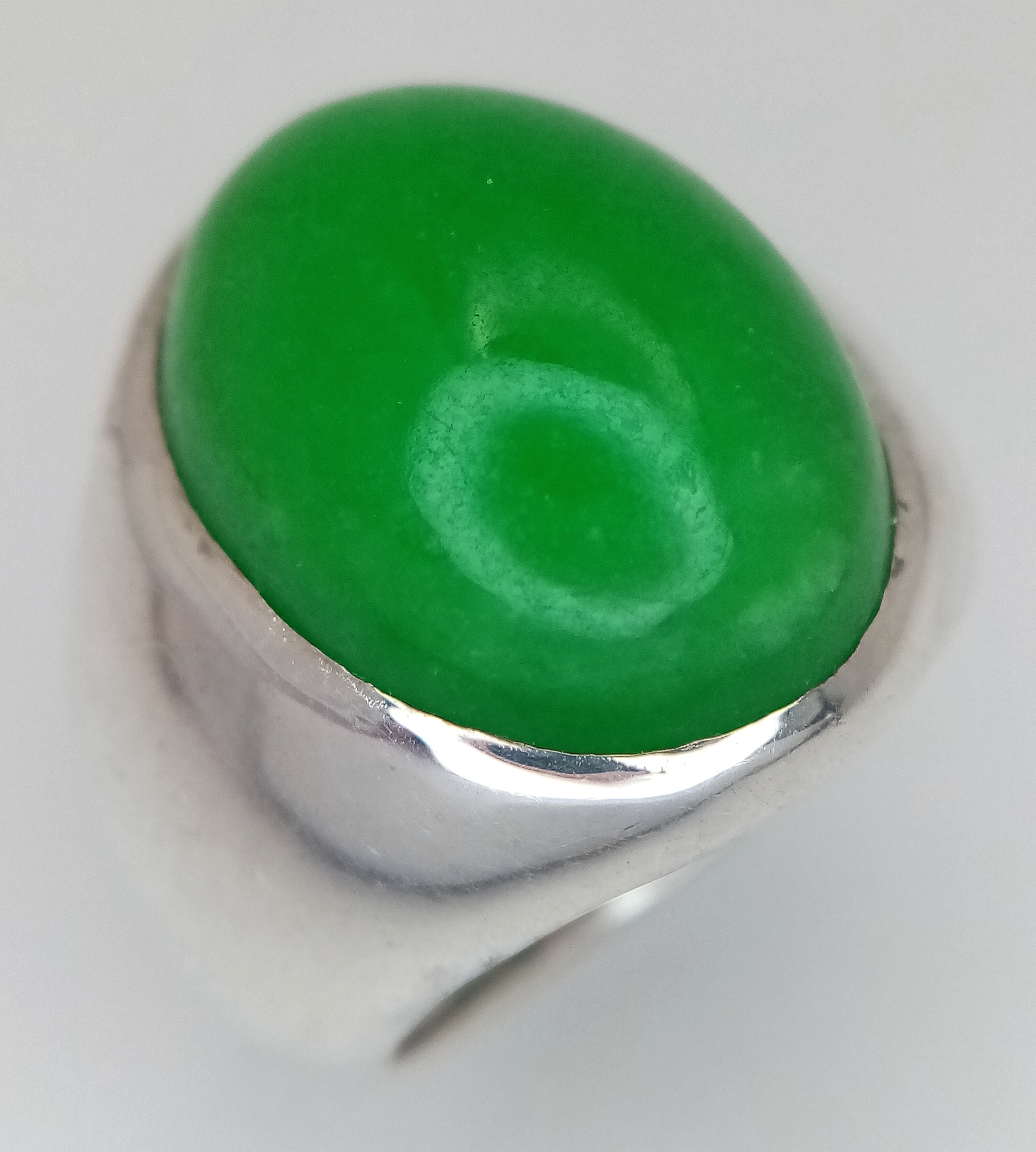 A Sterling Silver (tests as) and Large Green Jade Cabochon Ring