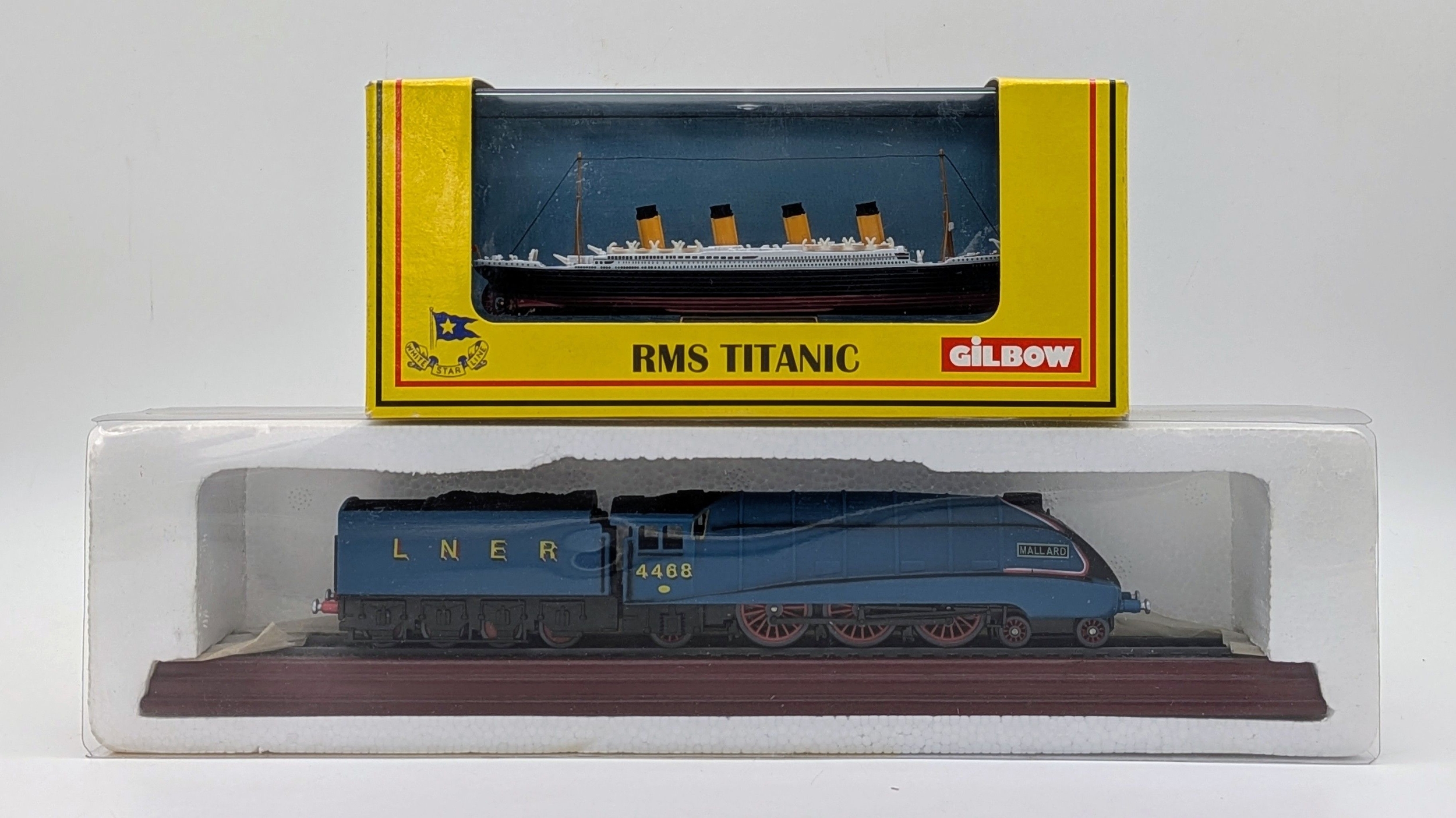 Two die cast model. The Titanic & The Mallard