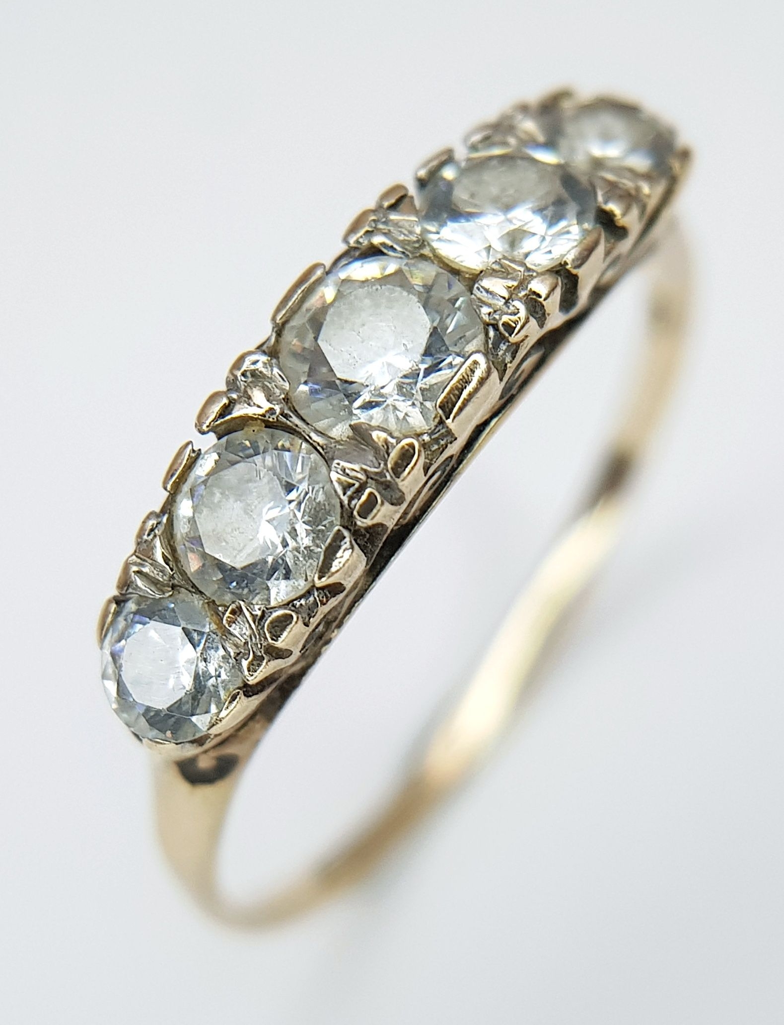 A 9K Yellow Gold CZ Five Stone Dress Ring
