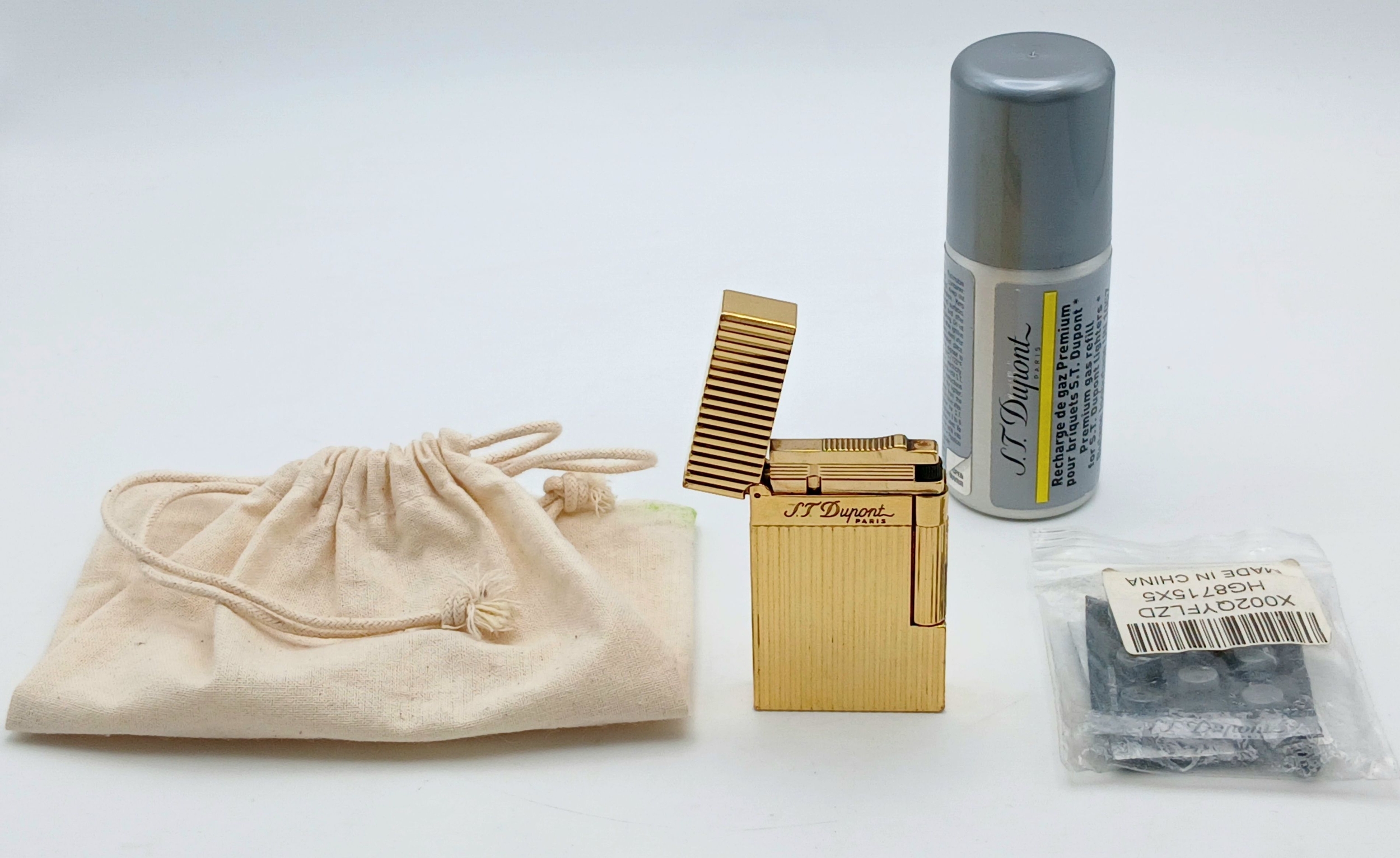 An S.T. Dupont Lighter. Comes with spare flint and gas