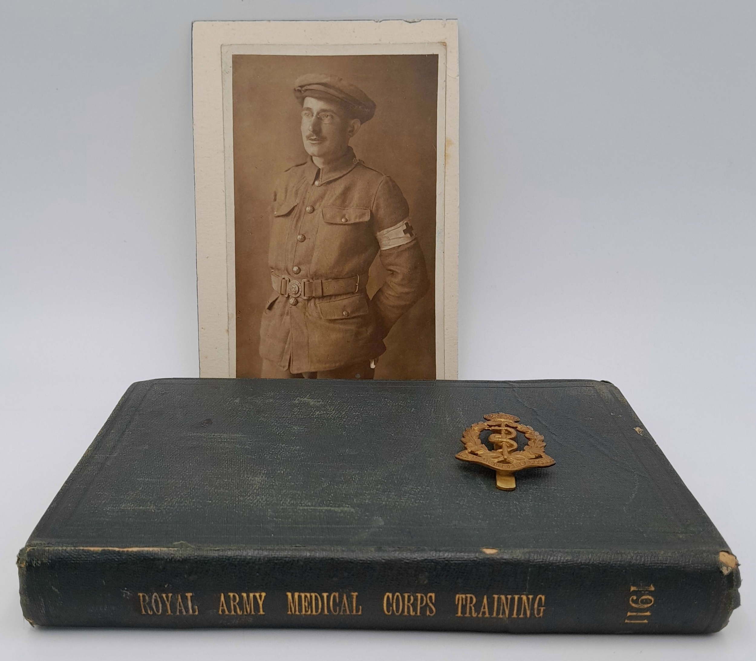 A 1911 Medical Corp Book - With photo and cap badge of owner
