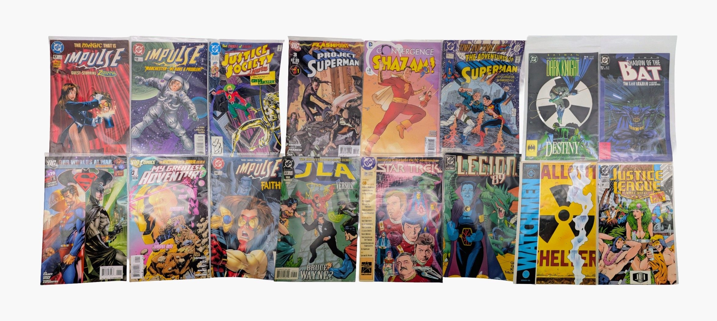 Sixteen DC Mixed Comics. All plastic wrapped