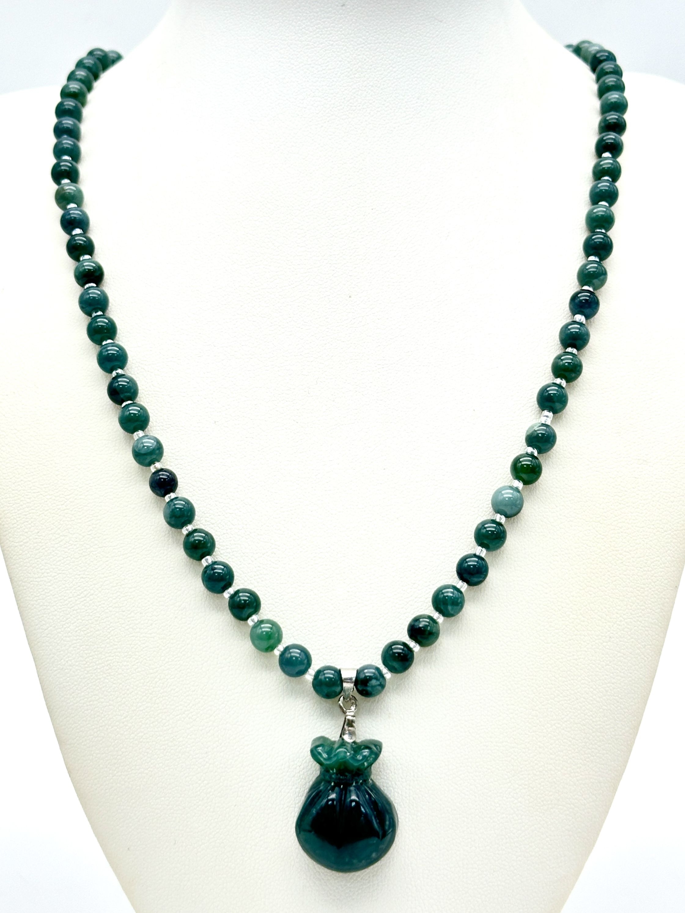 A Green aventurine stone Beaded Necklace with a large hand carved bag of gold