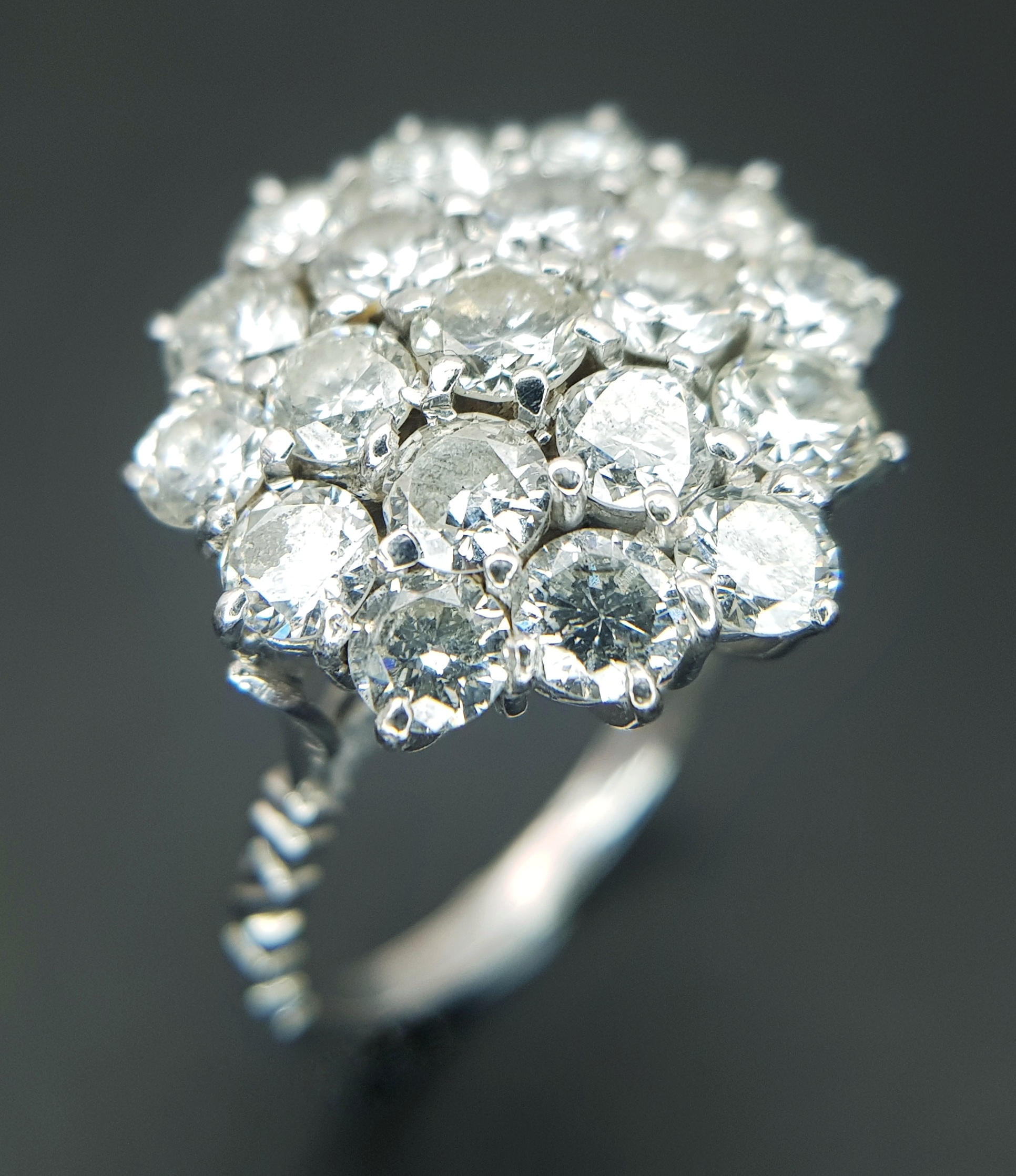 An 18K White Gold and Diamond Cluster Cocktail Ring. c.2ctw of round brilliant