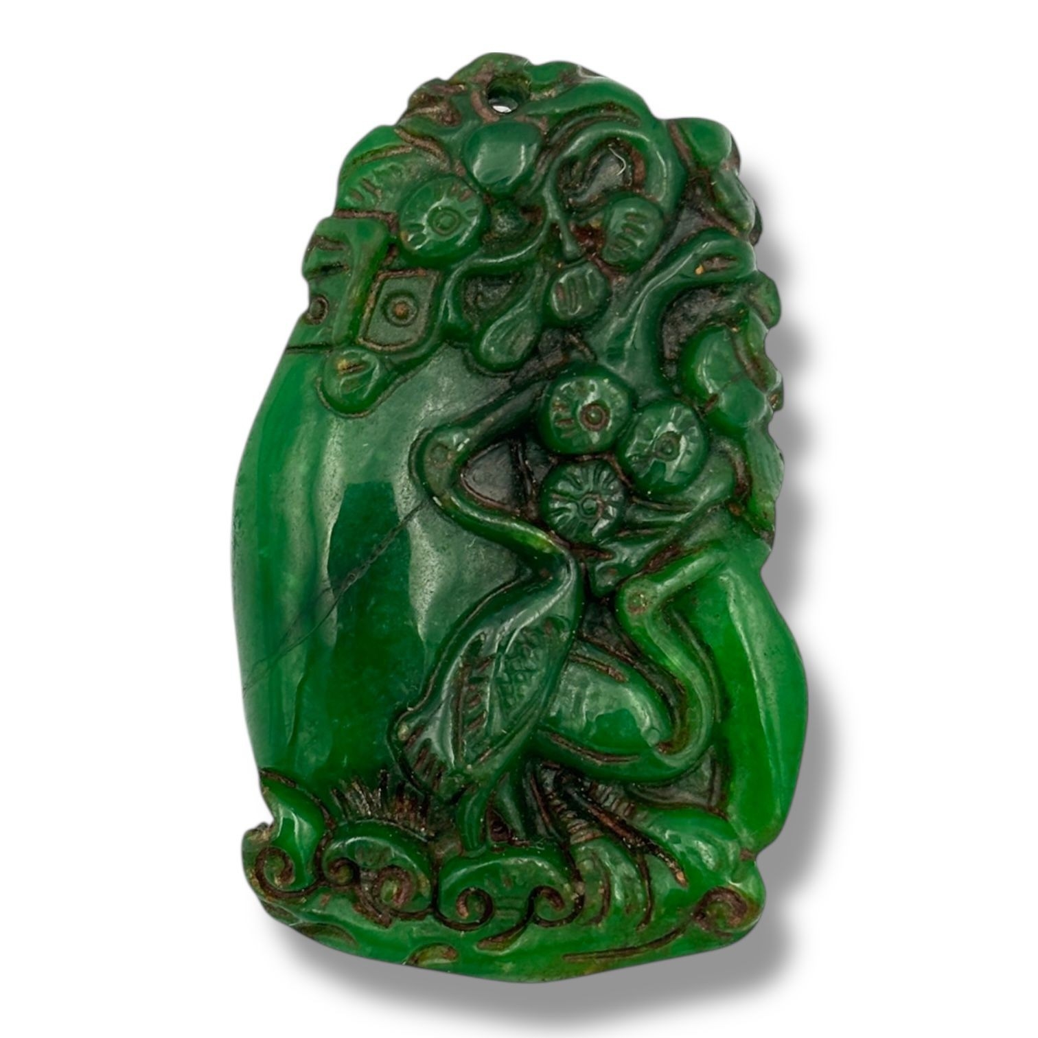 A lovely antique Chinese hand carved jadeite floral motif pendant