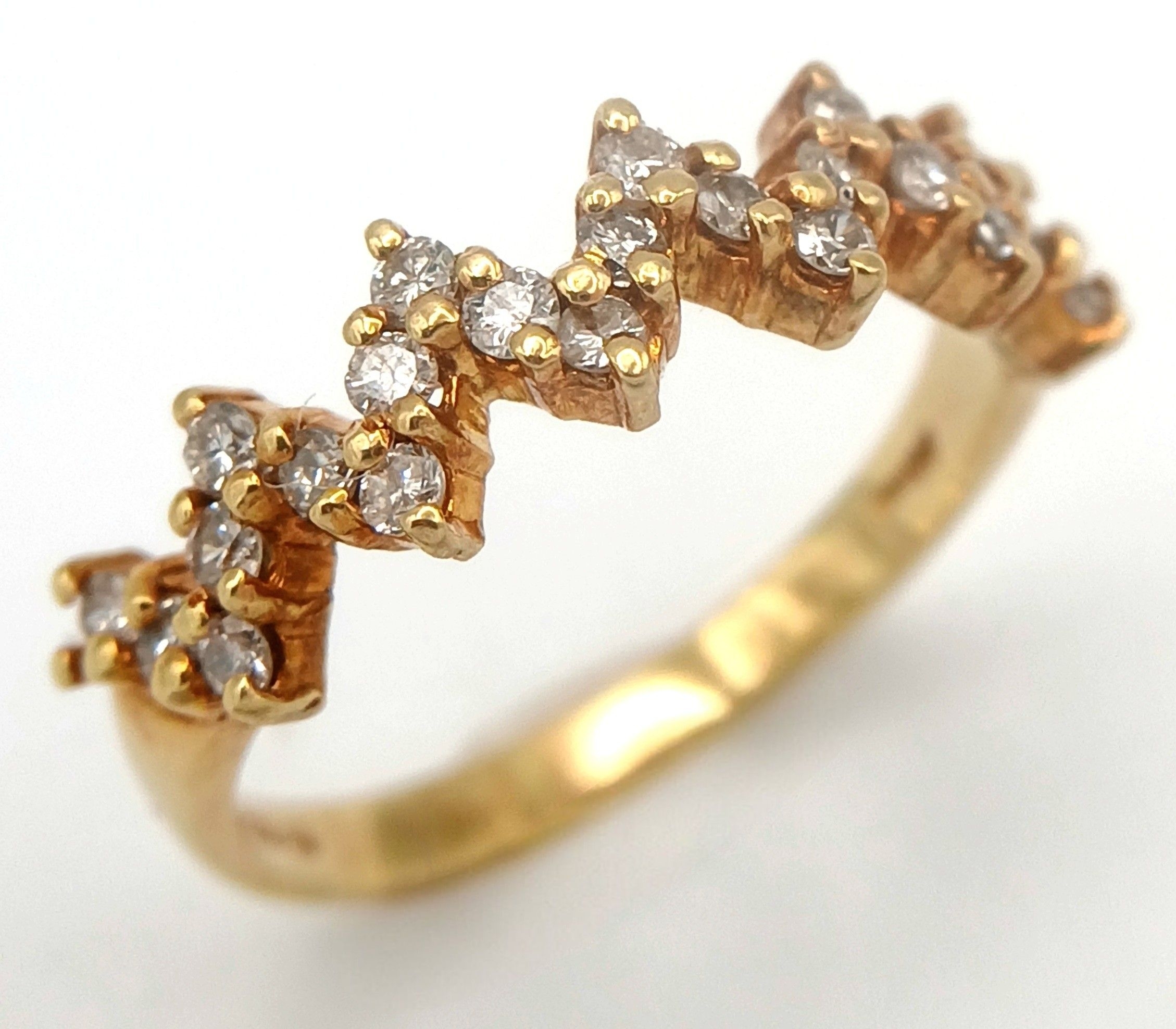An 18K Yellow Gold Diamond Set Ring