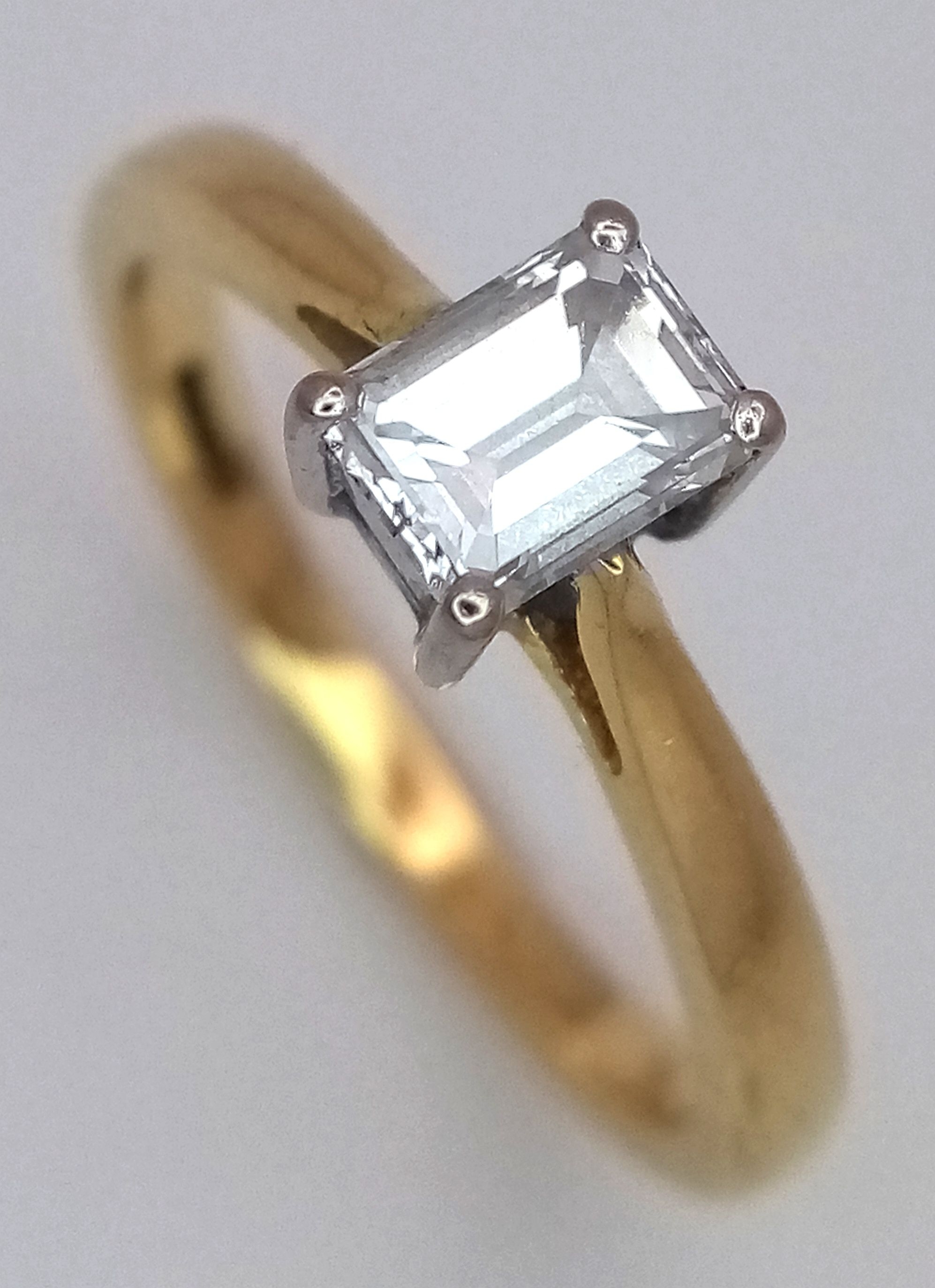 An 18K Yellow Gold and Diamond Solitaire Ring
