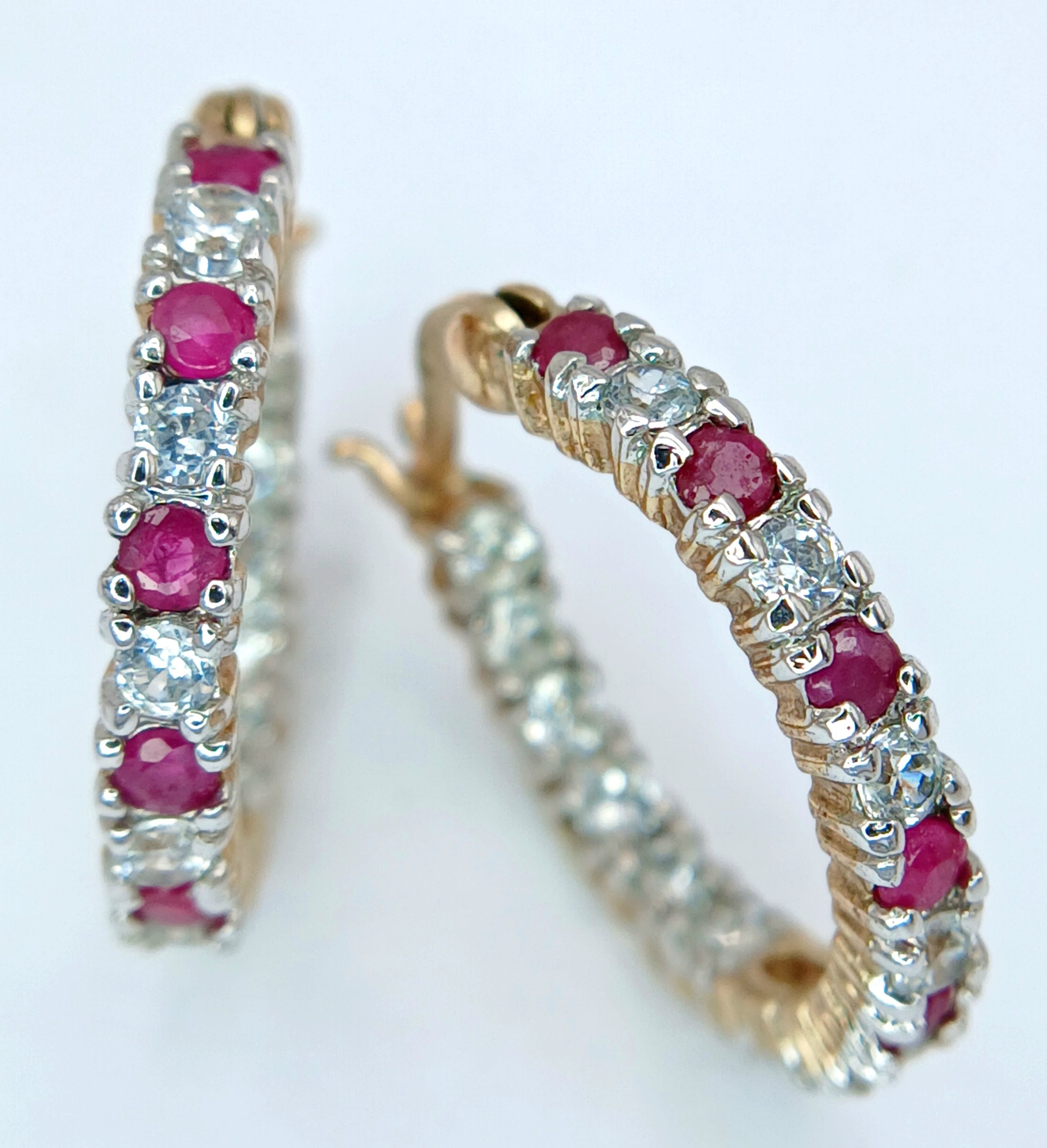 A VERY PRETTY PAIR OF GOLD FILLED EARRINGS WITH PINK AND WHITE STONES . 3gms