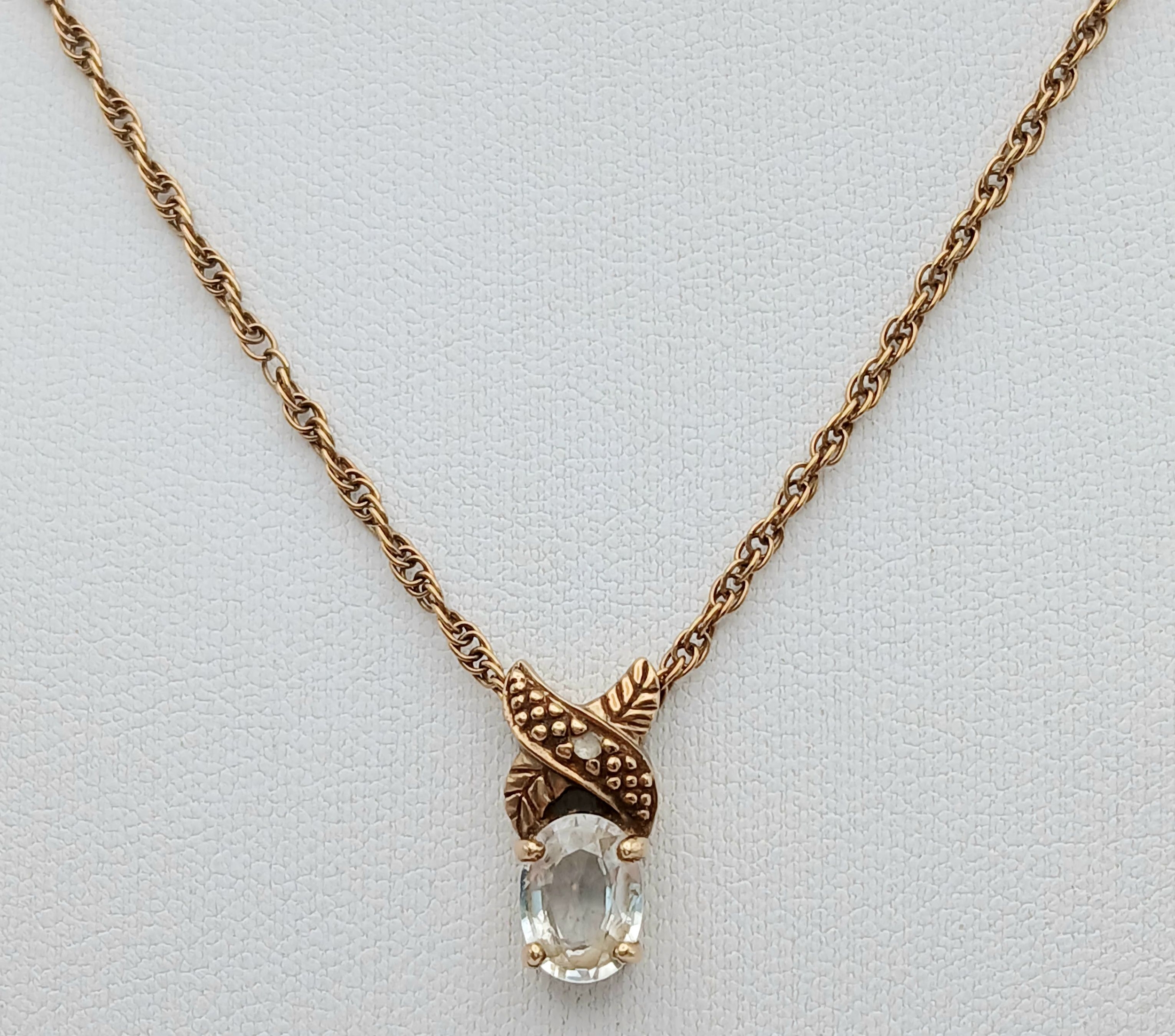 A 9K Yellow Gold Prince of Wales Link Chain with White Stone Pendant