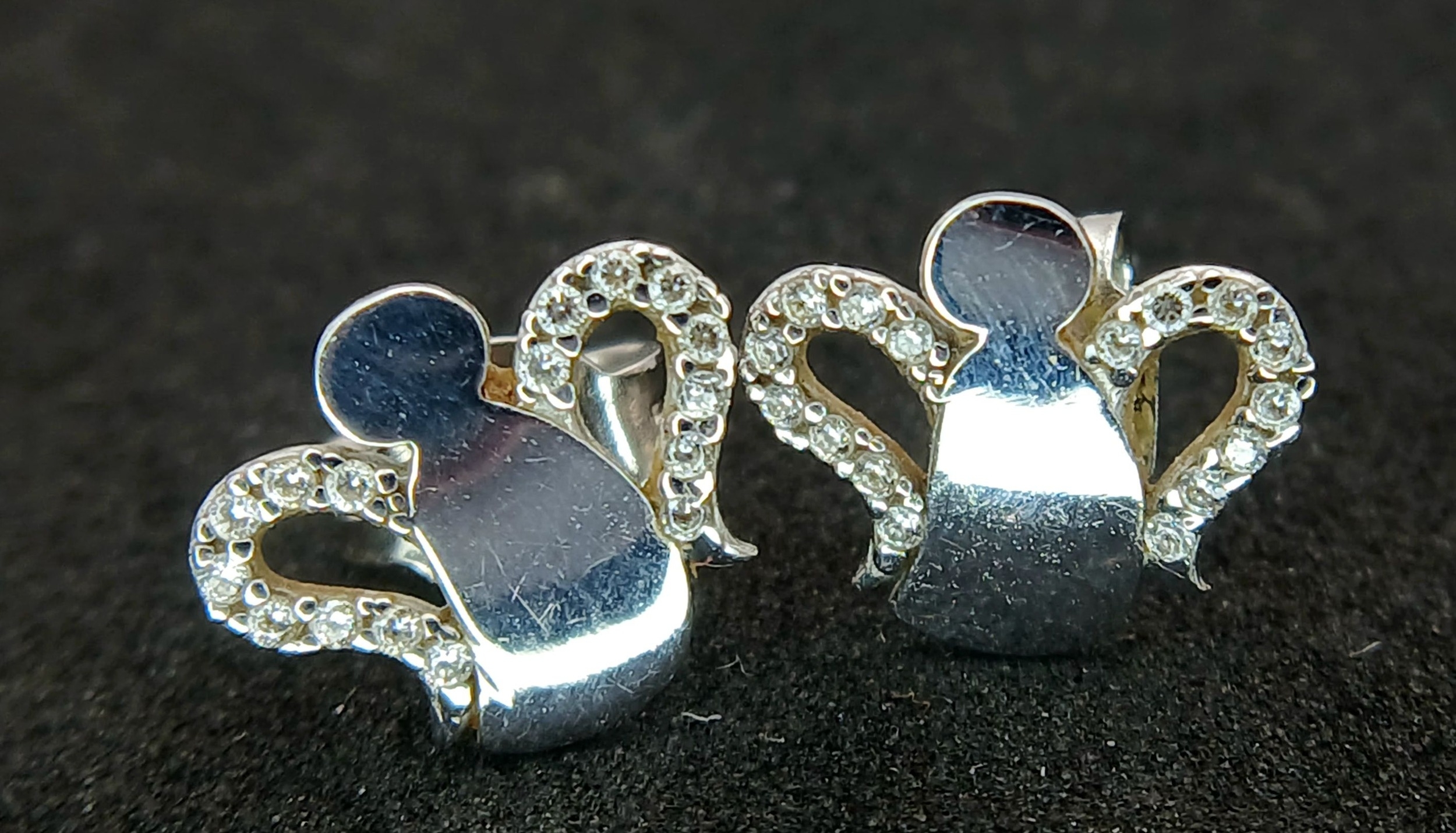 A PAIR OF 18K WHITE GOLD, DIAMOND SET, ANGEL STUD EARRINGS