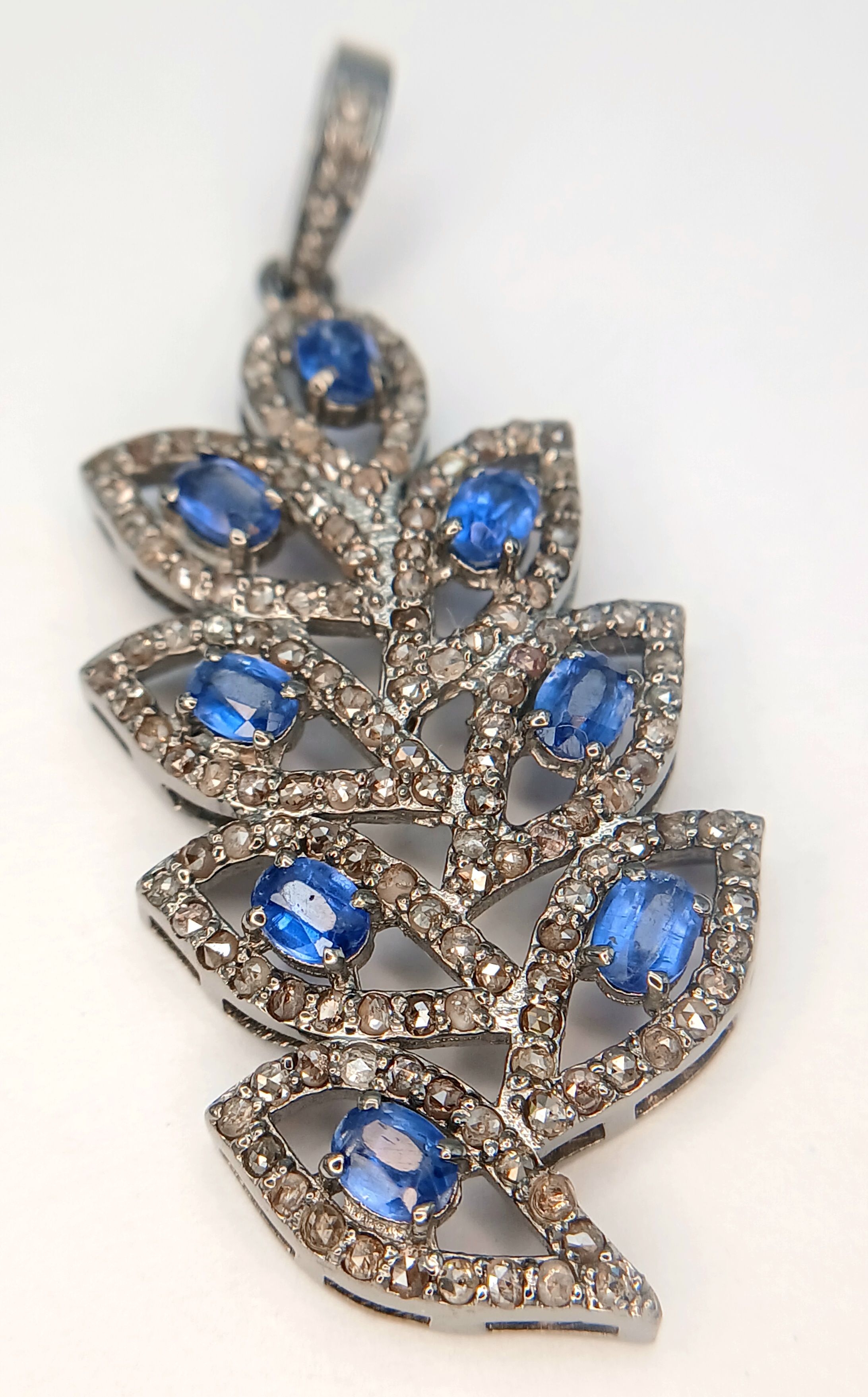 A Kyanite and Diamond Pendant in Floral Form