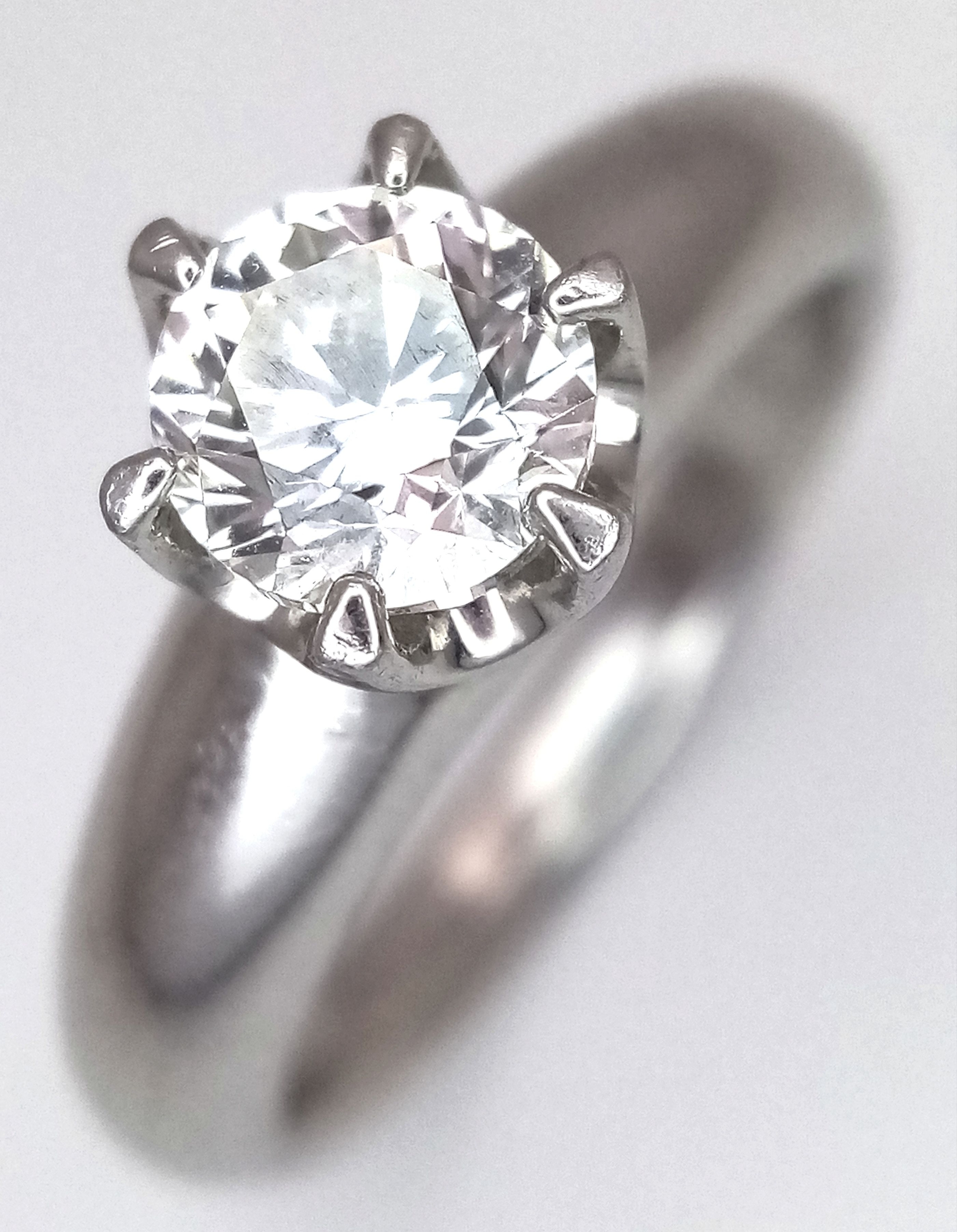 A STUNNING DIAMOND SOLITAIRE RING SET IN PLATINUM AND HAVING A 1.2ct TOP QUALITY