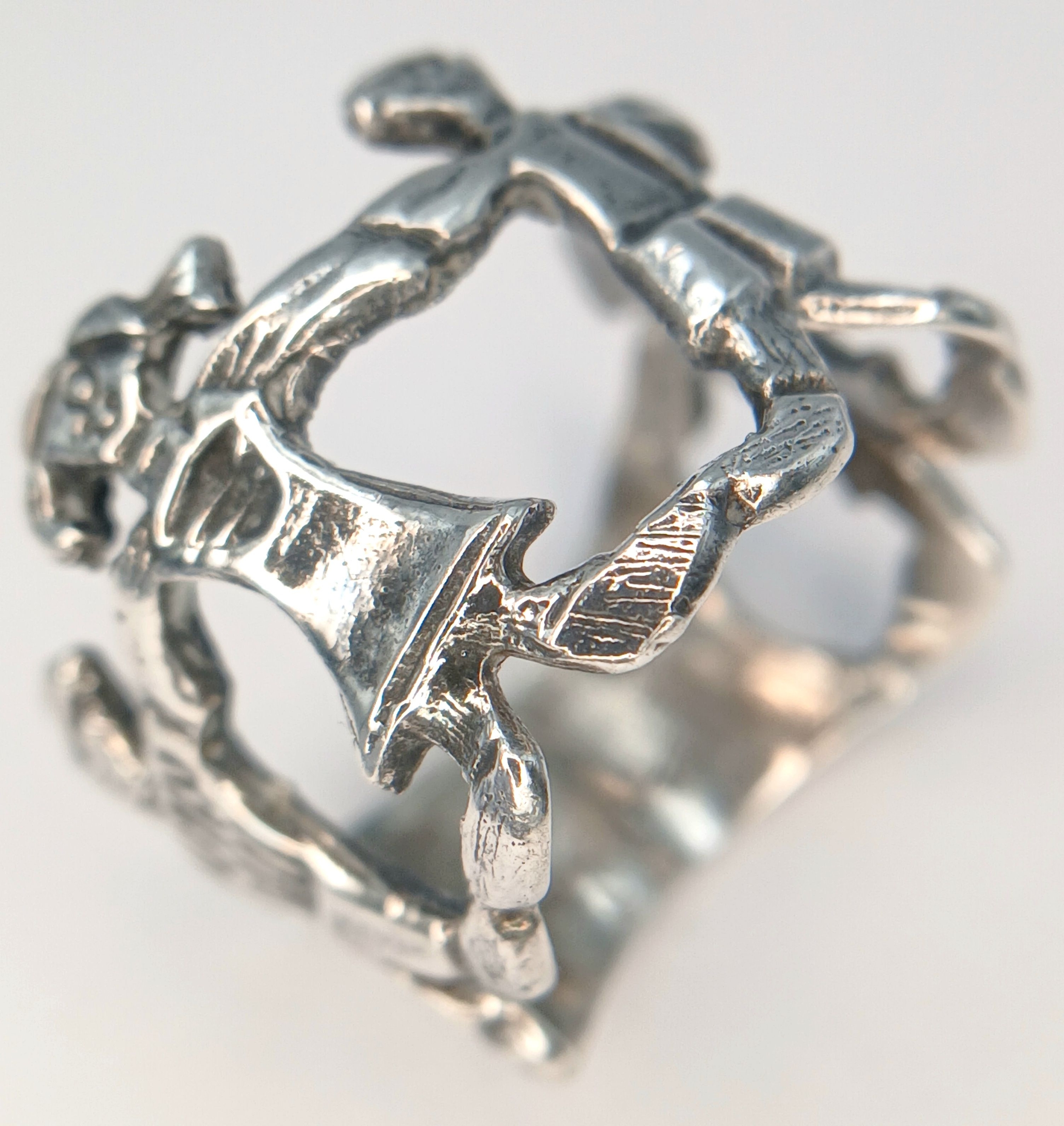 A silver Children holding hand ring