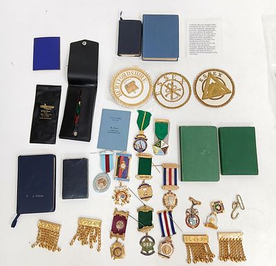 A BAG FULL OF MASONIC MEDALS , JEWELS, APRON BADGES AND BOOKS .(PLEASE SEE PHOTOS)
