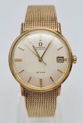 A Vintage 9K Gold Omega De Ville Gents Watch. Automatic movement. 9K gold strap and case - 