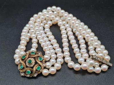 A Three-Row Akoya Pearl Collar with an 18K yellow Gold Diamond and Emerald Pendant - With a 