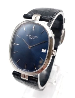 A RARE PATEK PHILIPPE STEEL WATCH WITH BLUE FACE ON ORIGINAL STRAP 28 X 33mm