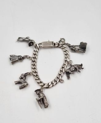 Sterling Silver Mexico Charm Bracelet with 6 Sterling Silver Mexican themed Charms - 62.2g.