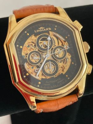 Gentlemans LINHART AUTOMATIC SKELETON WRISTWATCH. Finished in gold tone having white hands on a 