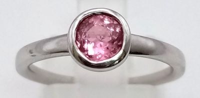 An 18K White Gold Pink Tourmaline Rub-over Ring. A beautiful pink tourmaline set in a rub-over 