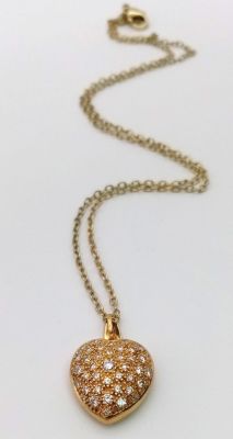An 18K Yellow Gold Heart-Shaped Diamond Pendant. With over 1ct of bright white diamonds this 