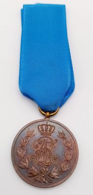 A Scarce German WW1 Friedrich August Medal Bronze Medal with Ribbon. The Medal, which is the 