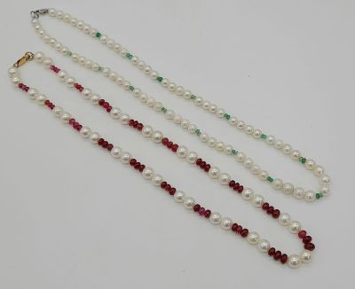 Two Cultured Pearl Necklaces - One with Rubies, the Other Emeralds. Both have 9k gold clasps. 