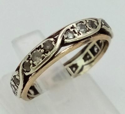 A 9K White and Yellow Gold White Stone Eternity Ring. Size M. 2.65g total weight.