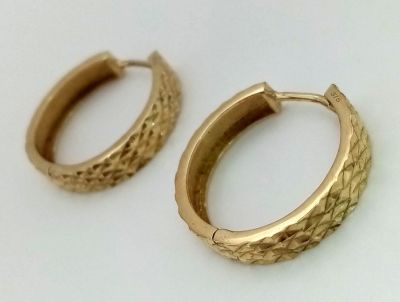 A Pair of 9K Yellow Gold Hoop Earrings. Geometric decoration. 2.25g total weight.
