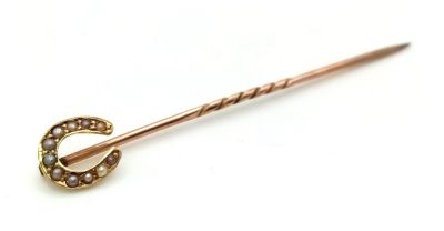 An Antique Victorian 15K Gold and Horseshoe Pearl Stickpin. 5cm.