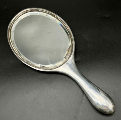 An Antique Silver Hand Mirror. Hallmarks for London 1912. Makers mark of Samuel Jacob. 28cm. 