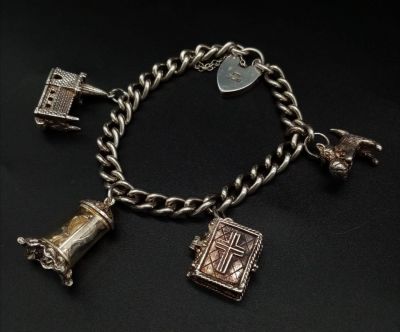 A Vintage 925 Silver Charm Bracelet with a Heart Clasp. Four charms including a pussy at play! 38g