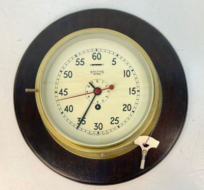 1940s Large Smiths Astral Ships Clock with key. Mounted on a mahogany plinth. Works well.