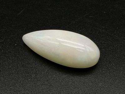 A 13.18ct Ethiopian White Opal. Oval cut with colour play. Comes with an ITLGR certificate.