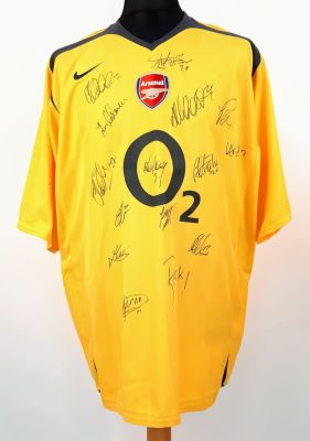 An Arsenal Football Club Signed 2006 Away O2 Yellow Shirt. Fifteen signatures including: Van 