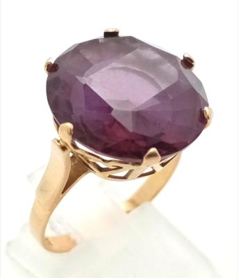 A Vintage Possibly Antique Middle-Eastern 18K Rose Gold Amethyst Ring. Large round-cut, well 