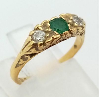 A Vintage 18K Yellow Gold Emerald and Diamond Ring. Size H. 2.5g total weight.