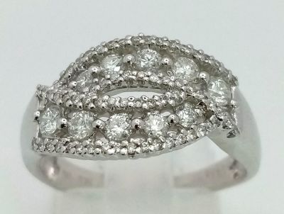 An 18K White Gold and Diamond Cluster Crossover Ring. 0.60ct approx. Size O. 4.8g total weight.