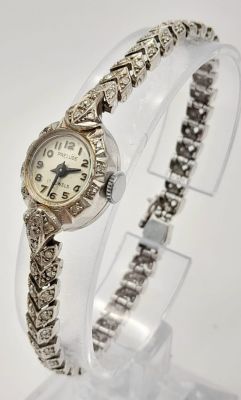 A Vintage 9K White Gold and Diamond Prelude Ladies Watch. 9k white gold and diamond chevron 