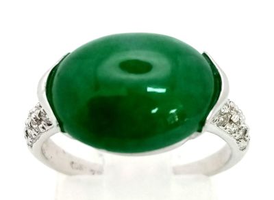 An 18K White Gold Jade and Diamond Ring. Green Jade cabochon with diamond shoulders. Size M. 4g 