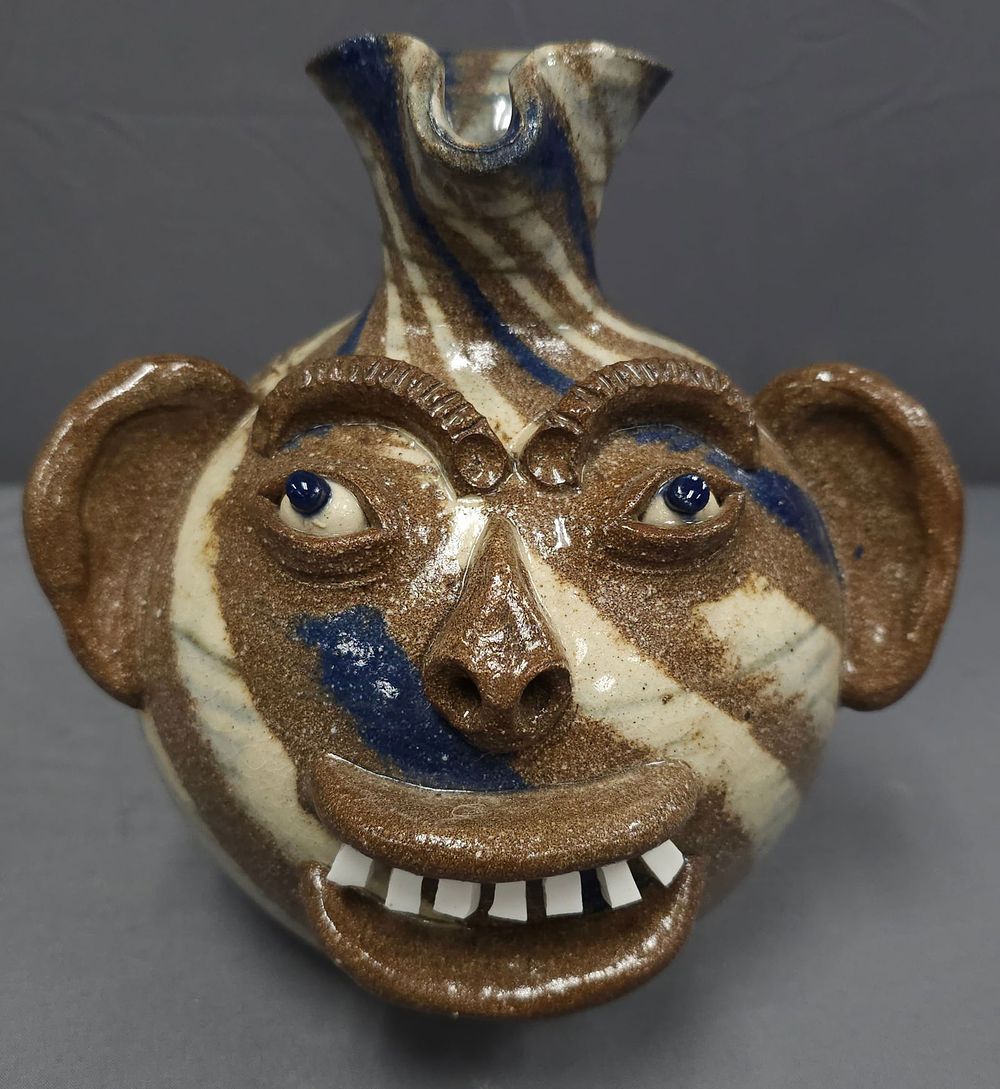 Lot 205: Stunning AV Smith Swirl Face Pitcher