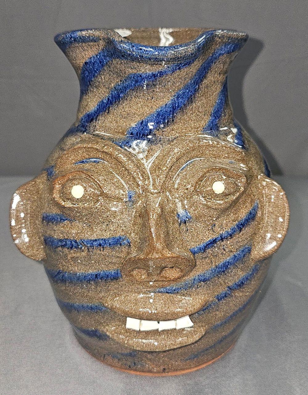 Lot 206: Walter Fleming Swirl Folk Pottery Face Pitcher