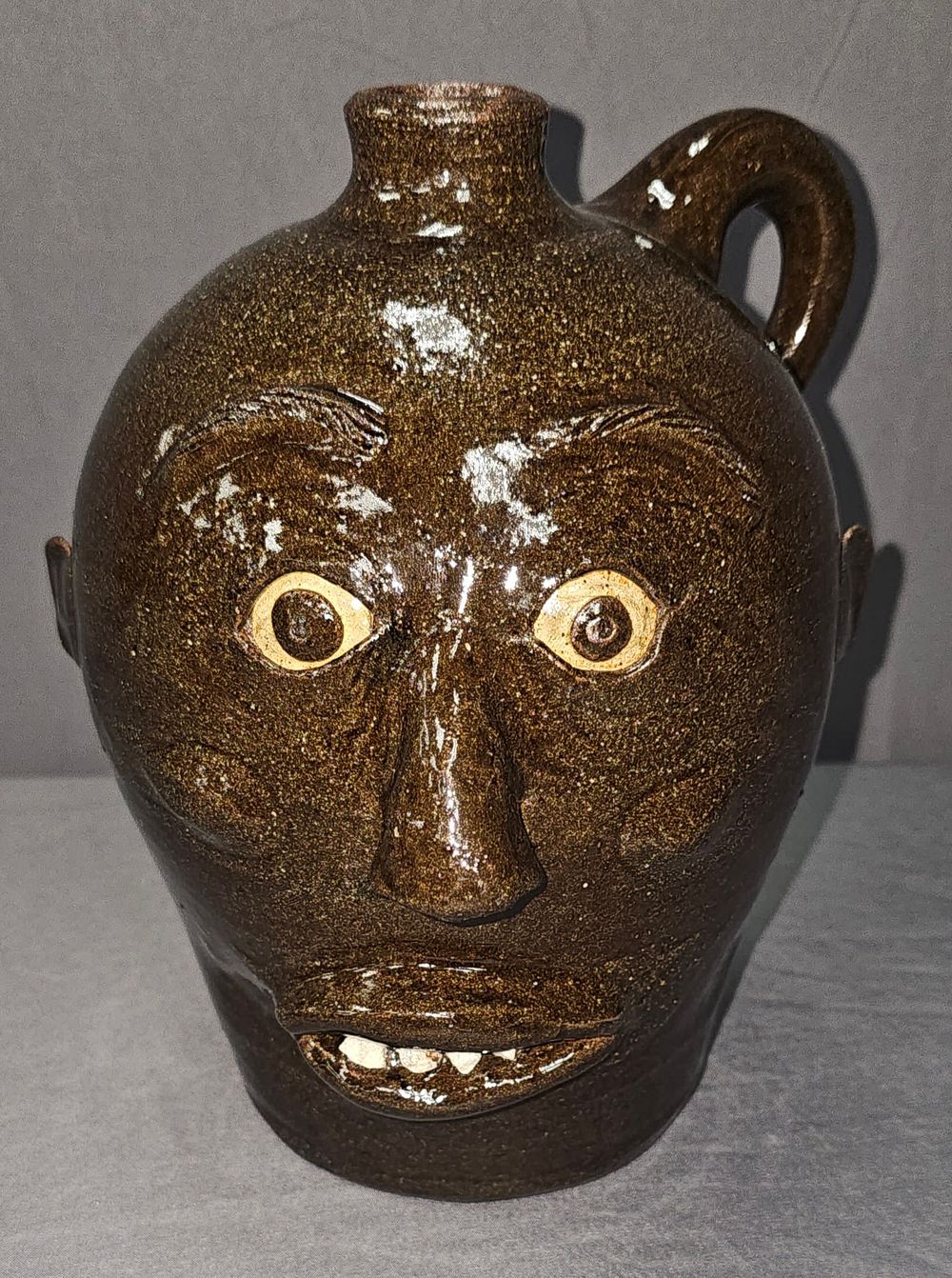Lot 234: Rare & Early Charlie West Face Jug