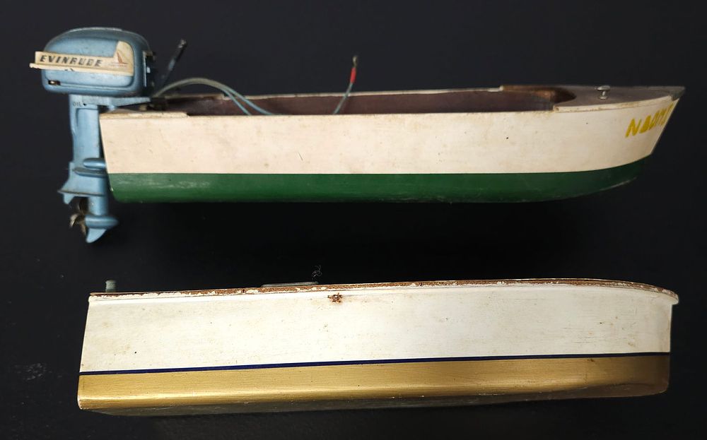 Lot 214: 1950 Wooden Toy Boat & Evinrude Electric Outboard