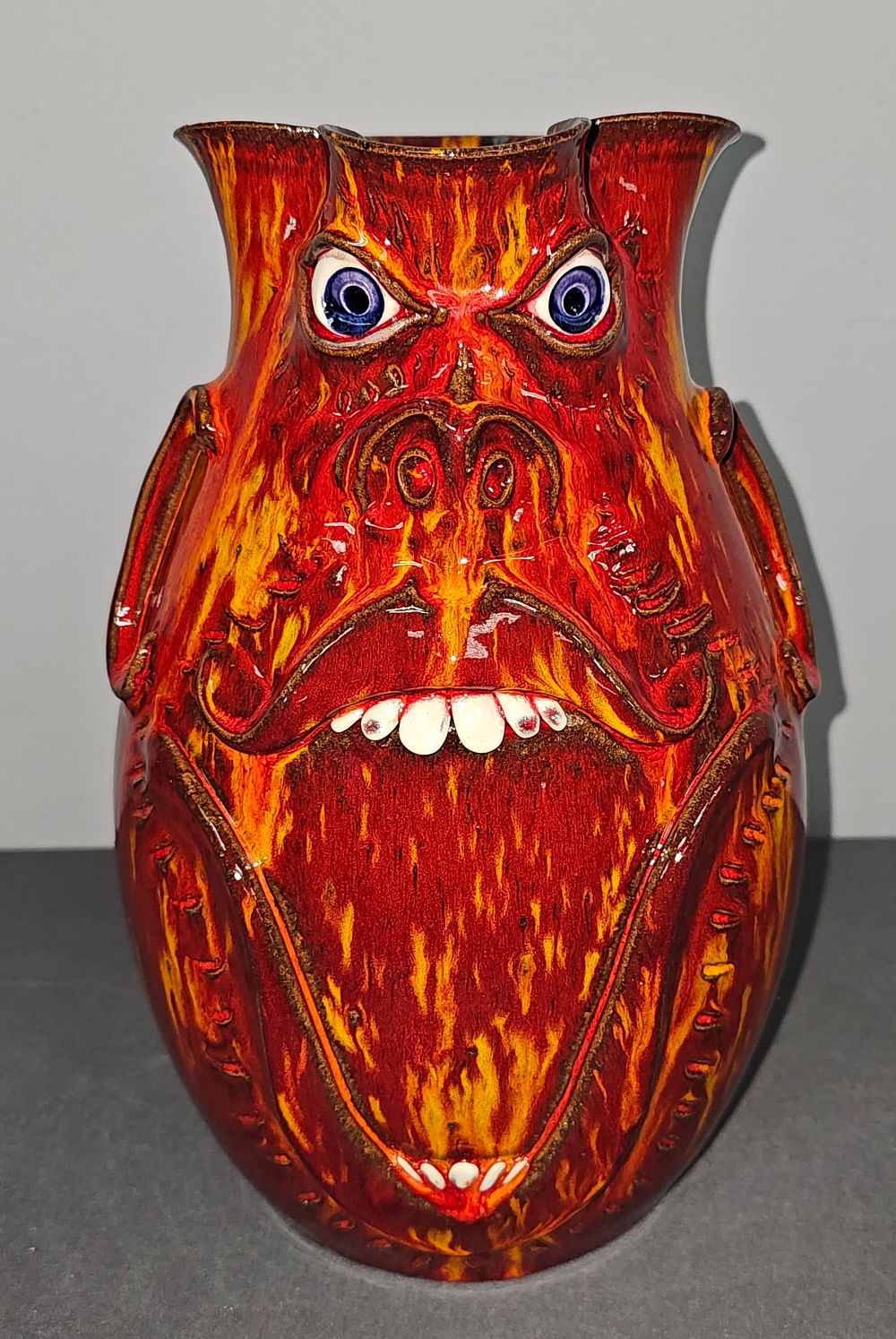 Lot 155: Stunning Roger Corn Fire Glaze Face Pitcher