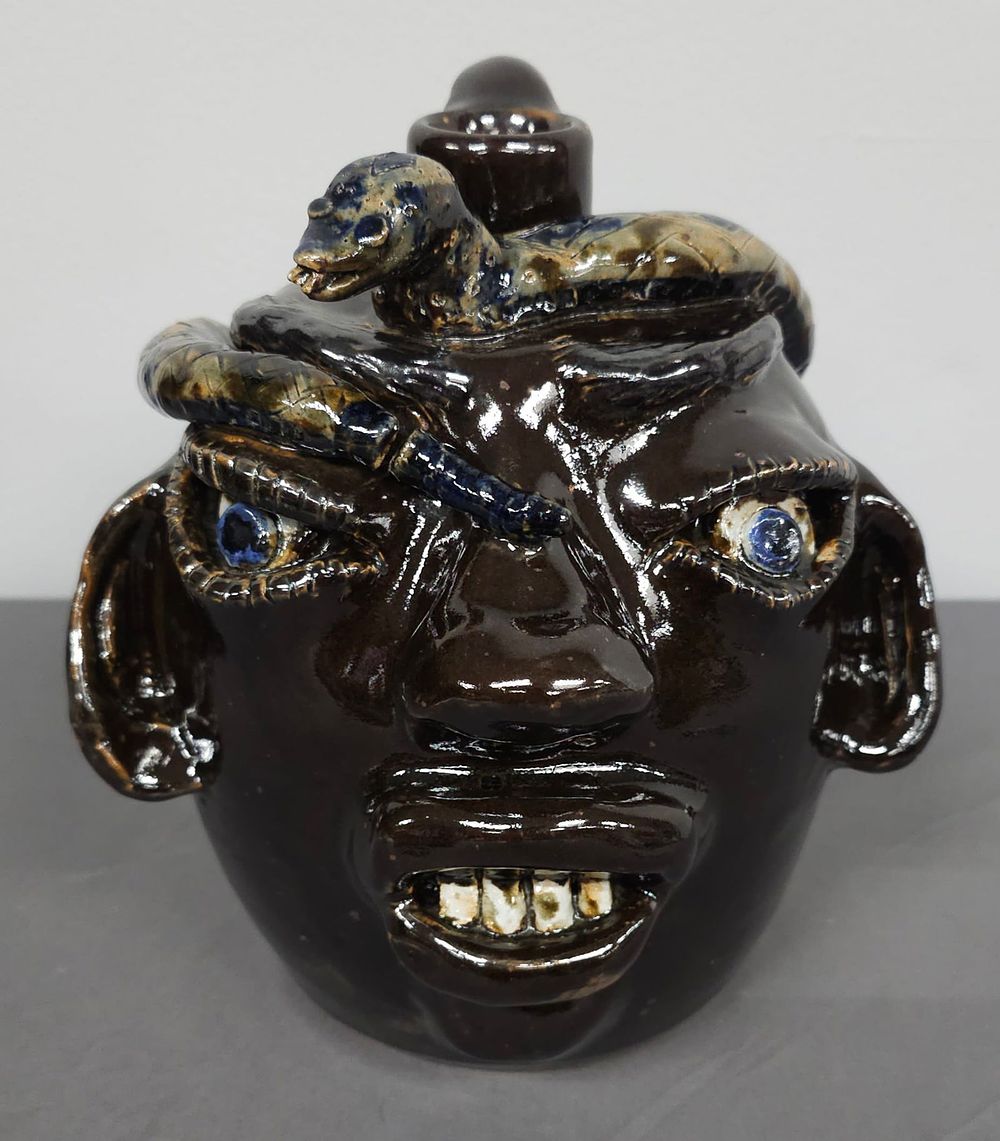 Lot 164: Rare Jerry Brown Diamond Back Snake Face Jug