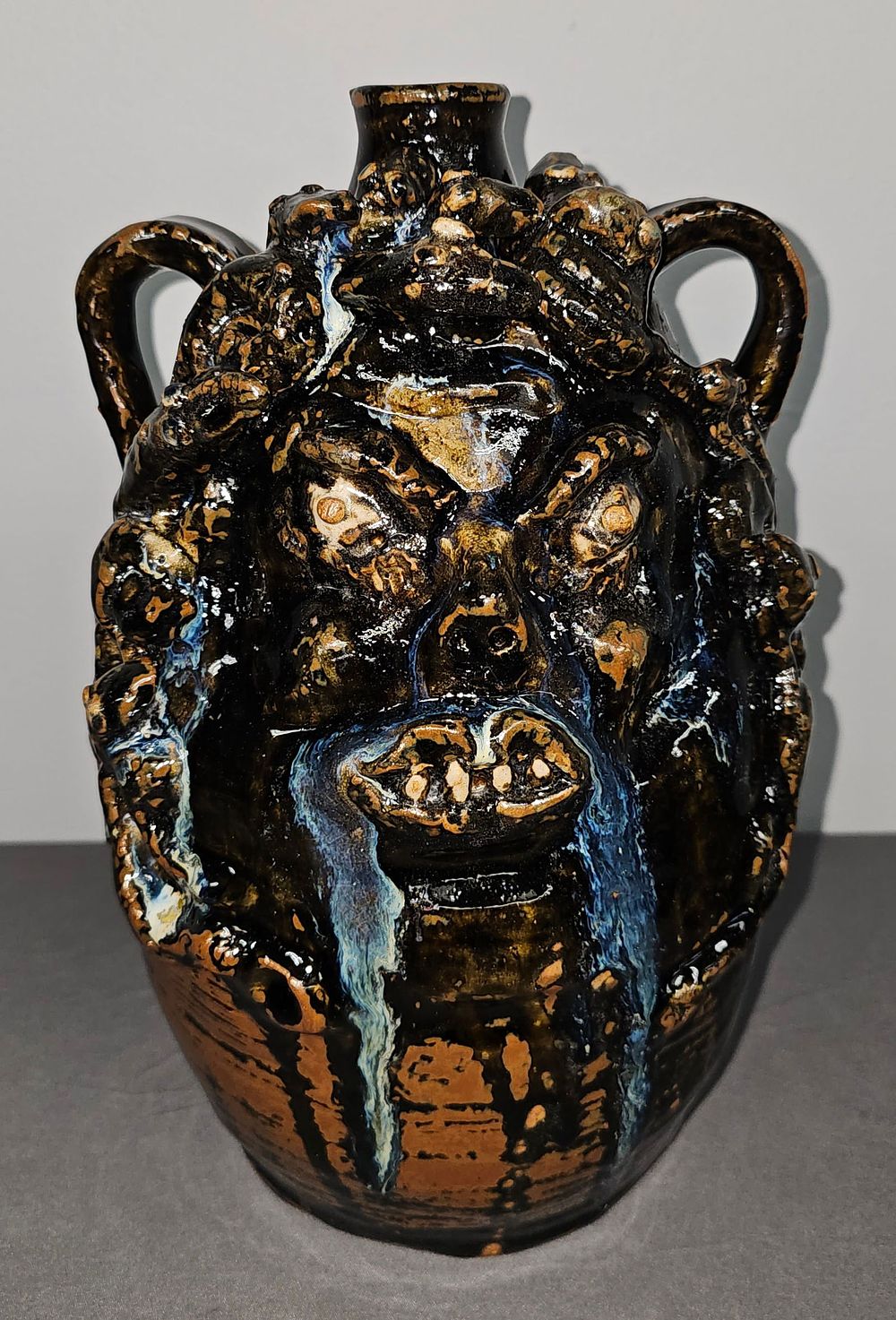 Lot 165: Significant Marie Rogers Medusa Face Jug